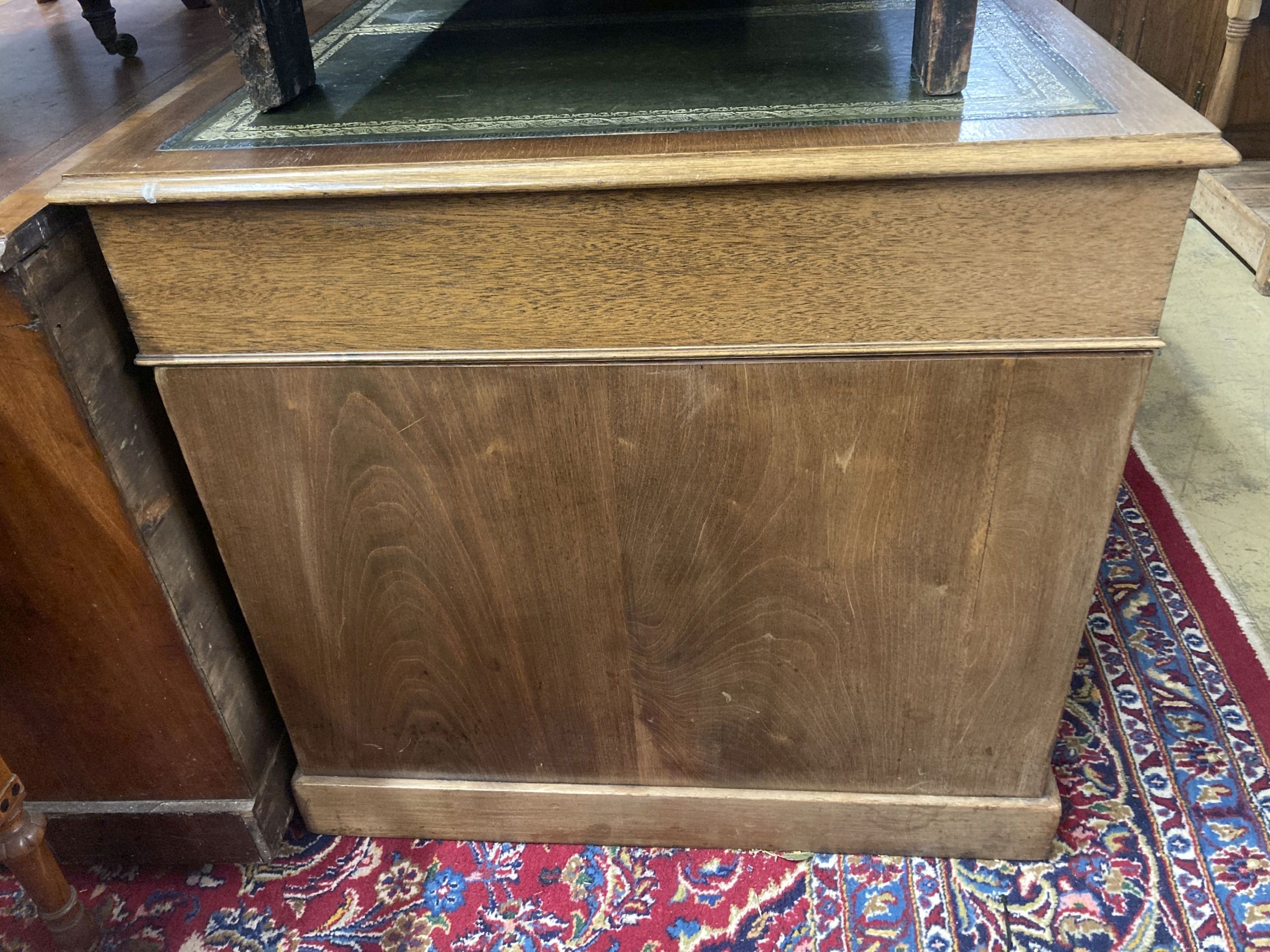 An early 20th century George III style mahogany pedestal desk, width 150cm, depth 81cm, height 76cm